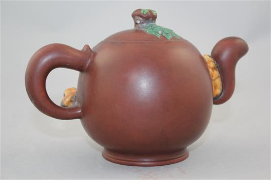 A Chinese Yixing enamelled pottery teapot, 20th century, 12cm.